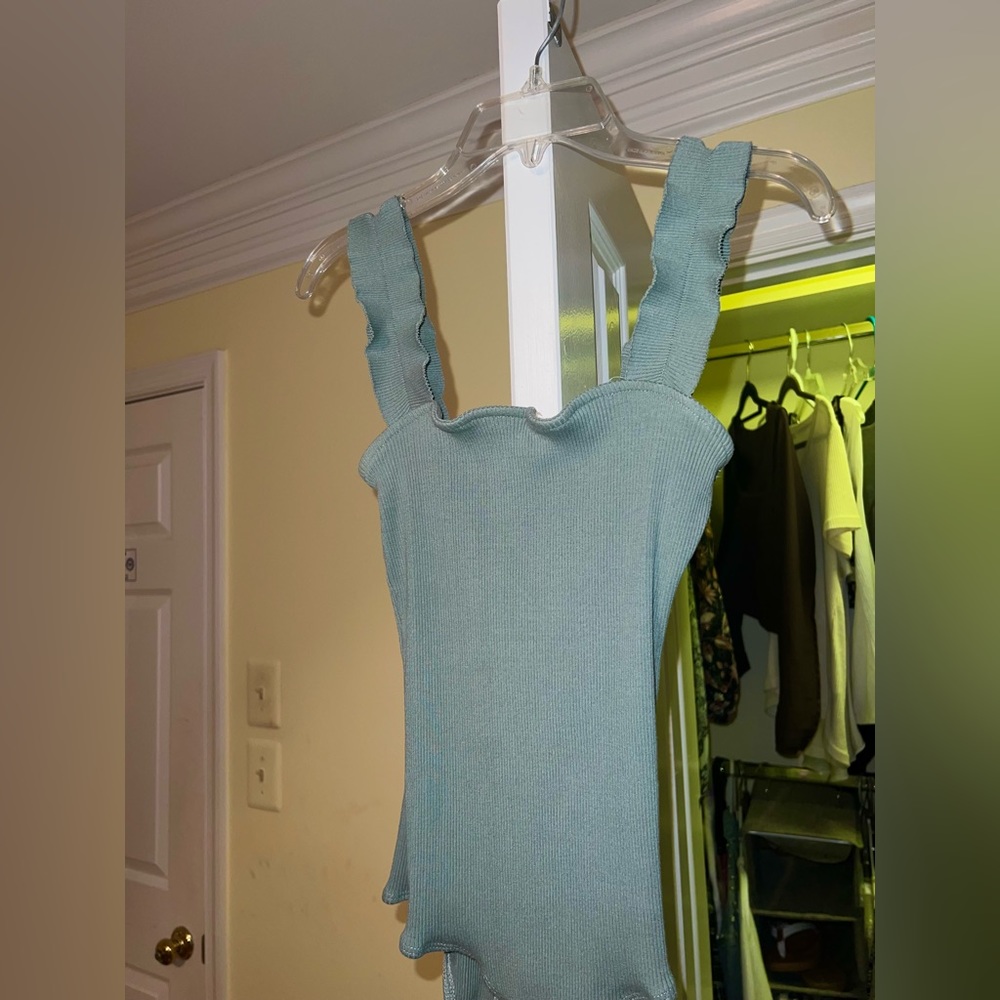 Very cute bodysuit with ruffled straps. Emerald/mint color
